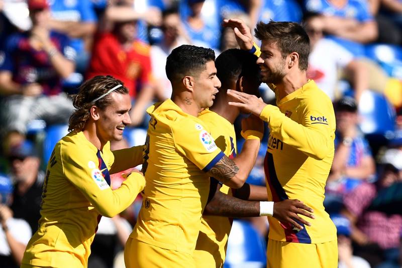 Barcelona's players celebrating a goal against Getafe / OSCAR DEL POZO/GETTY IMAGES