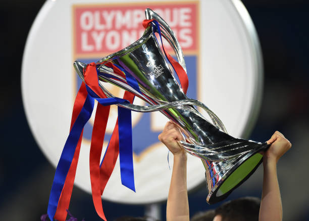 Olympique Lyonnais players hold aloft the trophy after winning the UEFA Women's Champions League Final 2017 in Cardiff, Wales. (Photo by Visionhaus/Corbis via Getty Images)