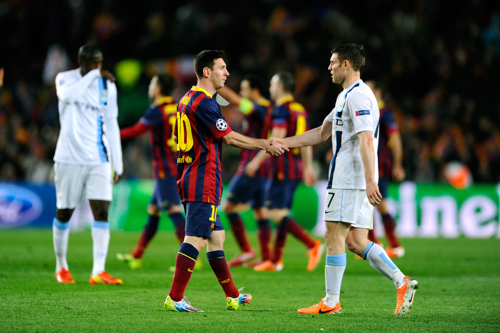 Messi shaking hands with James MIlner/ David Ramos/Getty Images